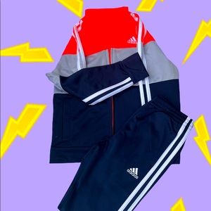 NWOT,Adidas Navy and Neon Orange Track suit.Never worn!Perfect!